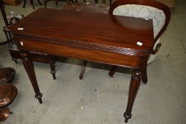 A Victorian mahogany fold over card table and fluted florette legs, width approx. 91cm