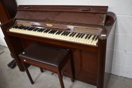 An Eavestaff Pianette mini piano and stool