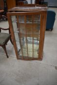 A mid 20th Century walnut china cabinet