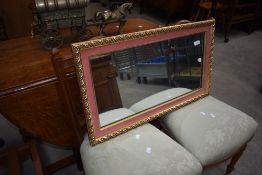 A vintage gilt frame mirror with pink mount detail, approx. 71 x 41cm