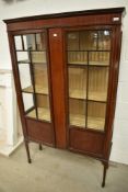 An Edwardian mahogany and inlaid display cabinet, on tapered legs and spade feet, width approx.
