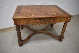 A 19th Century burrwood table having inlaid top and frieze drawer and twist leg, William & Mary