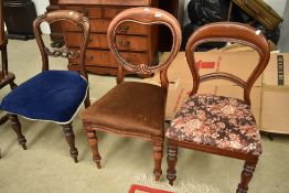 A harlequin set of three Victorian balloon back dining chairs