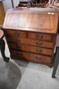 A reproduction yew wood bureau - key included