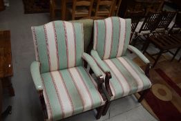 A pair of modern upholstered armchairs having wood frames, Gainsborough style
