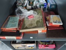 A shelf of vintage games including an original Frederick Warne & Co Ltd Peter Rabbit Race Game