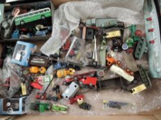 A box containing 00 scale vehicles and accessories