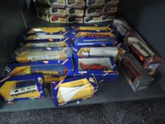 A shelf of 1980's Corgi diecast advertising vehicles and later Trams etc, all boxed (15)
