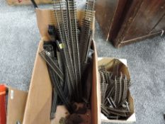 A box containing Peco, Hornby and similar 00 gauge track
