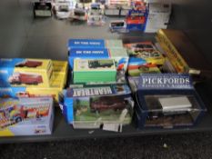 A shelf of modern Corgi diecasts including On The Move, Chipperfield, Pickfords etc, all boxed
