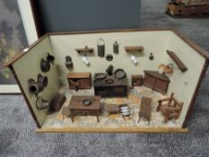 A Victorian Dolls House Kitchen having tin plate stove and wooden furniture and fittings