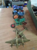 A Chad Valley diecast and two similar plastic vintage Tractors and two brass WWII Fighter Planes
