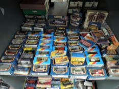 A shelf of 1980's and later Matchbox diecasts including Cars, Buses, Vans etc, 75 series and three