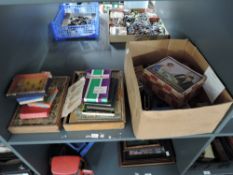 A shelf of vintage puzzles and card games including Richter's Anchor Box Building Stone set in three