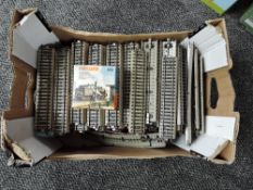 A box containing 125 pieces of Marklin HO Track, straights, approx 25 metres