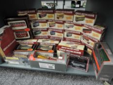 A shelf of Atlas and EFE diecast Buses, all boxed, approx 30