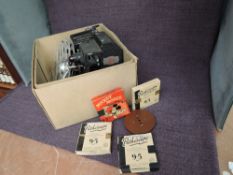 A Astor Cine Film Projector with five 9.5mm reels including Mickey Mouse