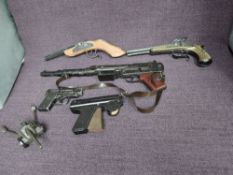 A Lone Star Strip Matic plastic Cap Gun, a Lone Star plastic toy Rifle, a Maku plastic Cap Gun, a