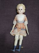 A possible German mid/late 19th century Wax over Plaster Headed Doll having sleep black eyes with