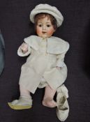 A early/mid 20th century Armand Marseille composition headed doll having sleep brown eyes, open