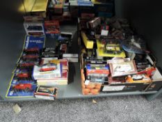 A shelf of modern diecasts including Corgi, Dinky, Majorette etc, all boxed approx 70