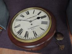 An early 20th century Railway Station style Wall Clock in mahogany case by A A Osborne and Co,