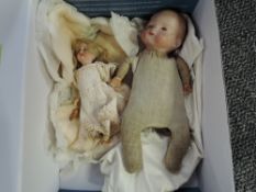 A early 20th century Armand Marseille bisque headed doll having sleep blue eyes, closed mouth, cloth