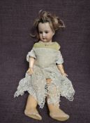 An early 20th century Heubach Koppelsdorf bisque headed doll having sleep blue eyes, open mouth with