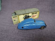 A Schuco tinplate Garage no 1500 with 1750 clockwork Car in blue inside