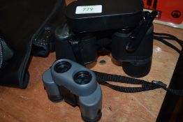Two pairs of binoculars. A set of Bushell 8x42 and a pair of Pentax 10x 21