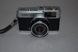 An Olympus Trip 35 camera in camera bag