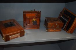 Three mahogany cased cameras some in parts
