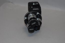 An Adco three lens 8mm movie camera in original leather case