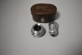 A Cannon 28mm ultra wide angle lens with view finder having Lieca mount in original case