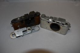 Two Leica camera bodies spares and repairs Nos 314990 and 534827