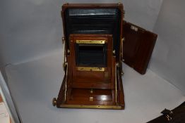 A mahogany Gandolfi whole plate camera. Comes with alloy case