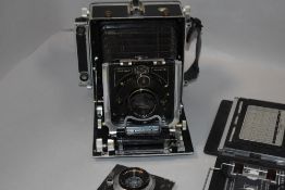 A Linhof Technika III field camera with Schneider Kreuznachlens and Mamiya Sekor lens etc