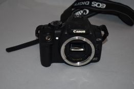 A Canon EOS 350D camera body with manual