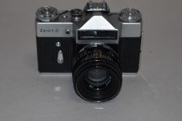 A Zenit E SLR camera with 58mm lens in original cover