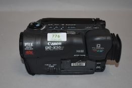 A Canon UC-X30Hi 8mm video camcorder in soft carry bag