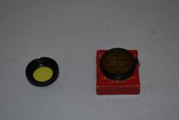 Two Leica filters. A FIHEL yellow and a FIPOS green (boxed)