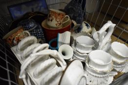 A selection of ceramics including coffee cans and table baskets