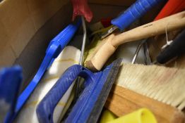 A selection of decorating items and paint brushes