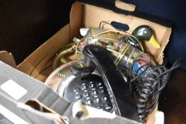 A selection of telephone sets including 90's see through