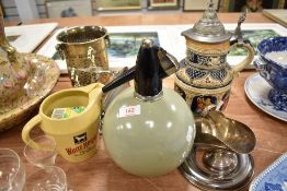 A vintage Globe Master soda siphon, a silver plated sugar helmet with shovel, German stein etc