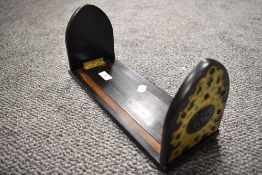 A Victorian brass-mounted coromandel bookslide, the lancet-form ends with fret-cut and incised brass