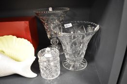 Two tapering cut-glass vases and a preserve pot.