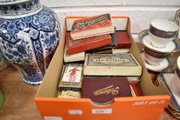 An assortment of vintage playing cards and card games.