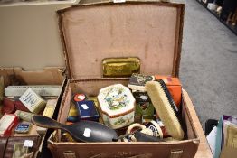 A vintage card suite case containing various vintage items, matchboxes with matches, powder compact,