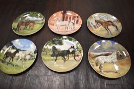 A box of display plates including Wedgwood and Spode, most boxed.